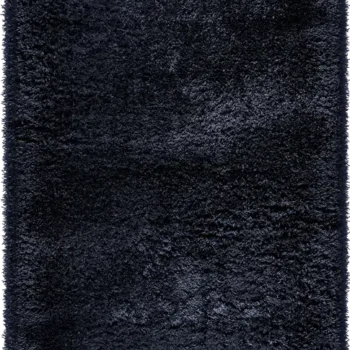Midnight Tundra rug with a deep, solid black with a plush, shaggy texture, giving it a luxurious and soft feel