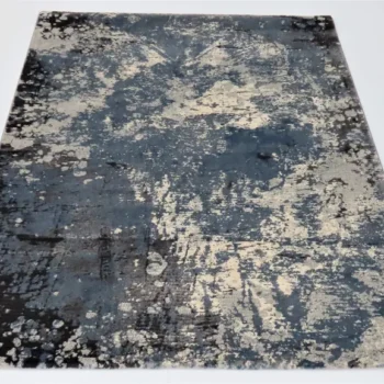 Luxurious Stripes rug featuring a blend of dark blue and grey colours with a splattered, abstract pattern