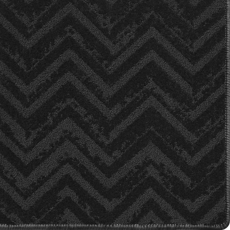 charcoal carpet rug with relic pattern and overlocked edges