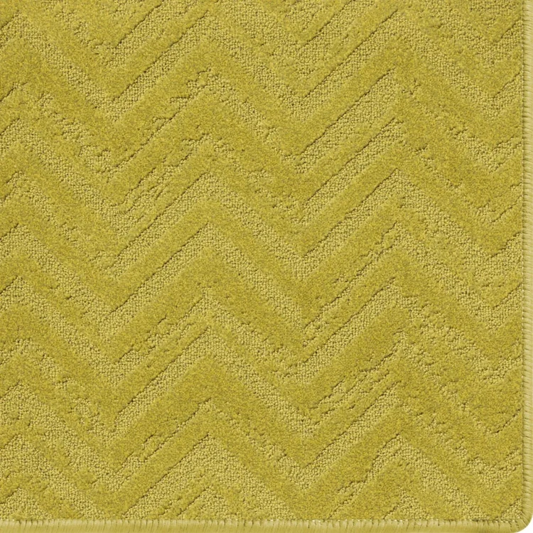 mustard rug with relic pattern and overlocked edges