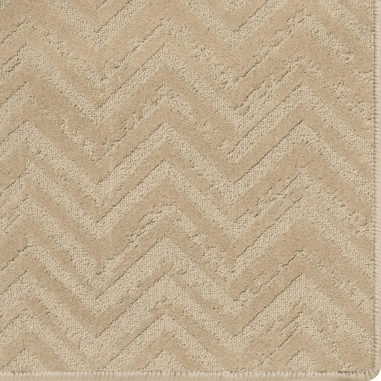 light brown earthy rug with relic pattern and overlocked edges