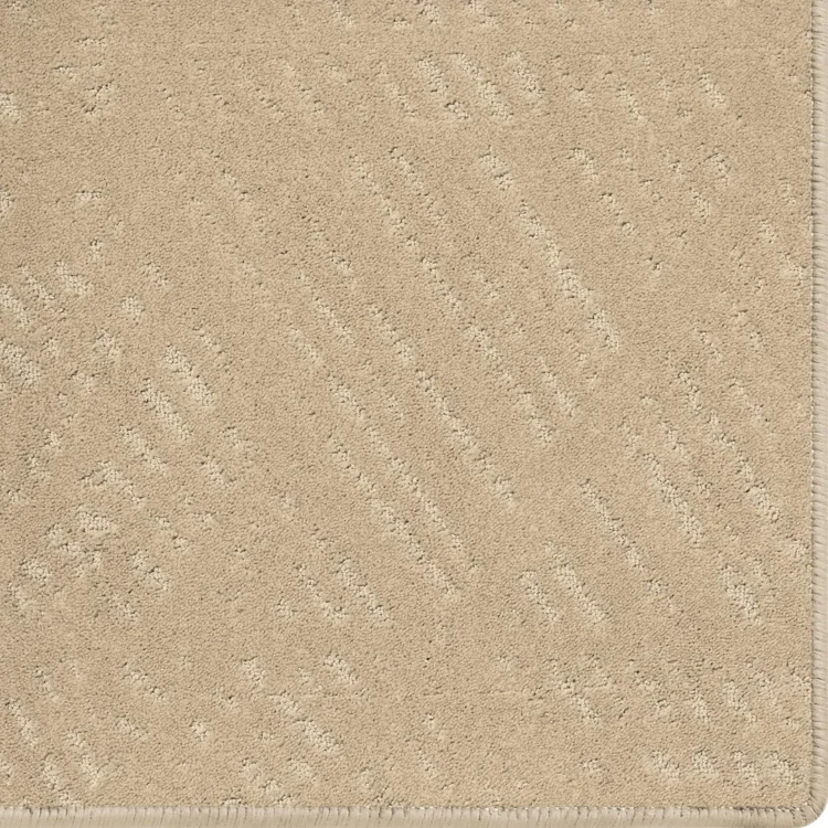 Light brown earthy carpet rug with scale pattern and overlocked edges