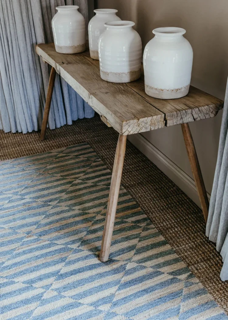 Small table sitting on horizon rug