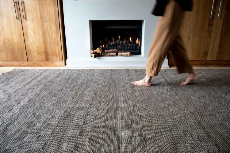 woman walking on impilo rug