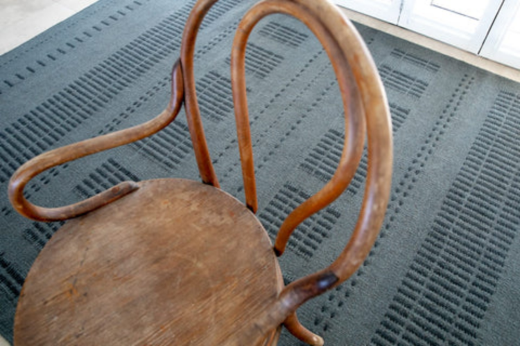 flat woven grey rug with solid and stripe pattern