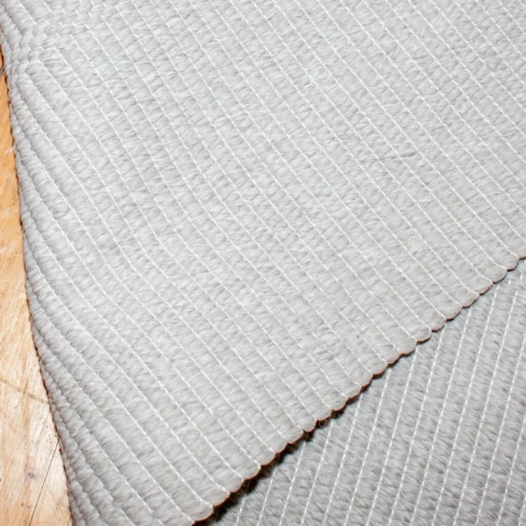 Cloud Veil Outdoor Rug folded over