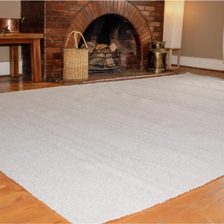 Cloud Veil Outdoor Rug in front of fire place